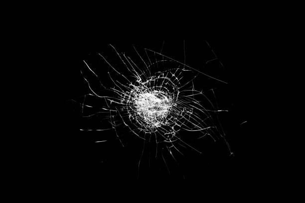 istock broken glass is insulated against a black background. white cracks 1345183085