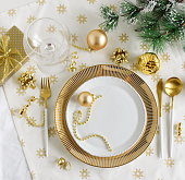istock Christmas or New Year table setting with white golden cutlery 1345184347