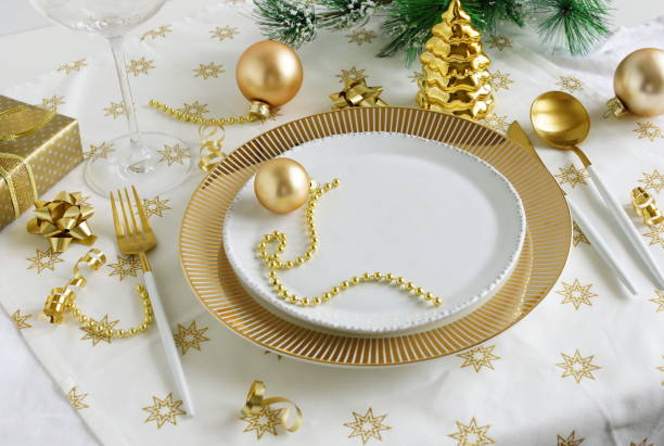 istock Christmas or New Year table setting with white golden cutlery 1345184616
