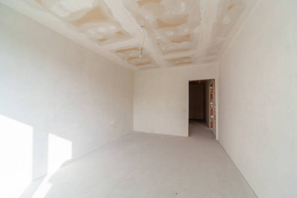 istock New empty room under construction. Plaster walls. New home. Concrete walls. Interior renovation. 1345185828