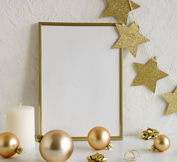 istock Gold frame mockup blank paper and Christmas decoration 1345186072