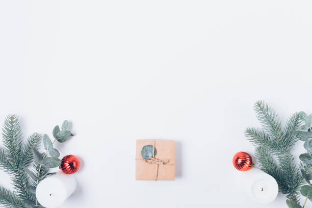 istock Christmas gift box next to fir branches 1345186282