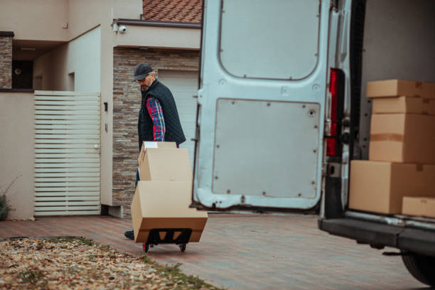 istock Delivery man making a delivery to a customer's home 1345186318