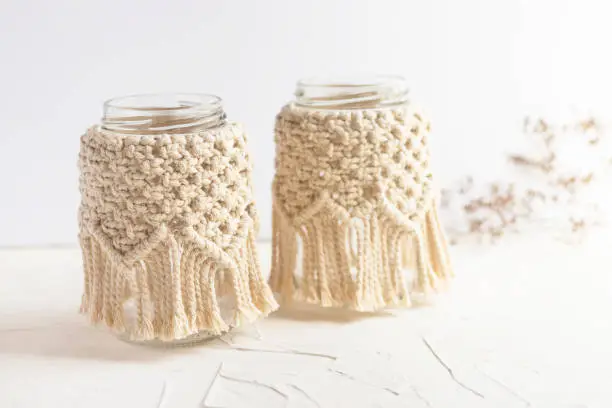 Small glass vases, two jars, candleholder with macrame cover. Dry herbs. Boho style. Bohemian home decor. Wedding accessory.