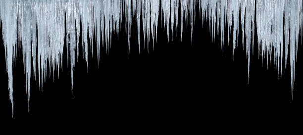 large group of long icicles on black large group of icicles isolated on black background icicles melting stock pictures, royalty-free photos & images