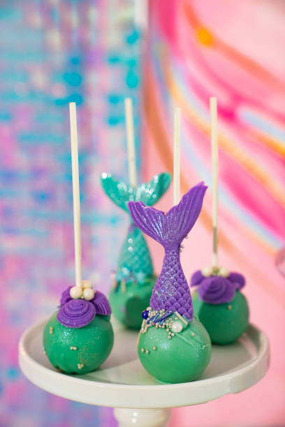 istock cake pops in a nautical style with a candle number five. 1345187824