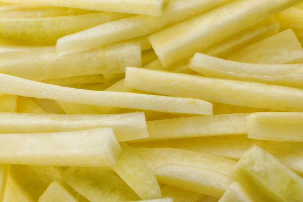 istock Raw white carrot sticks as background, closeup 1345187977