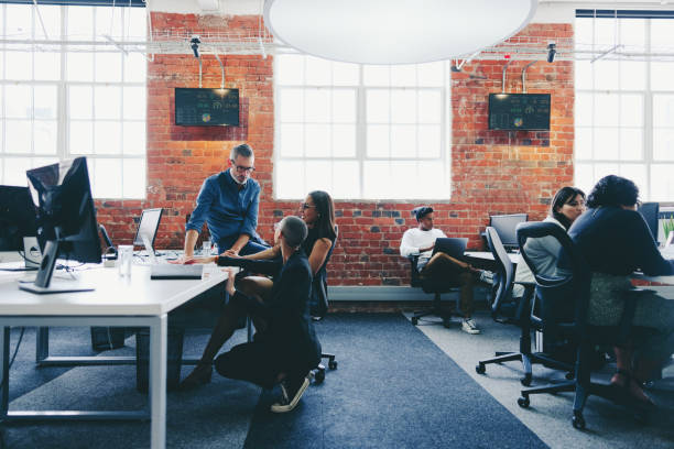 istock Modern businesspeople working together in a creative office 1345188388