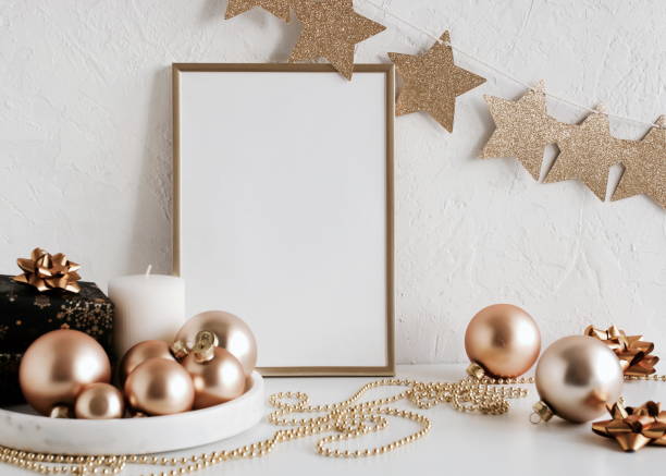 istock Gold frame mockup blank paper and Christmas decoration 1345188518
