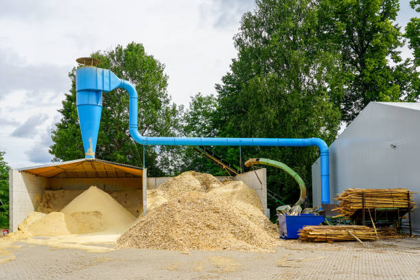 istock blue ventilation pipe and a stack of sawdust under it in the sawmill yard 1345190343
