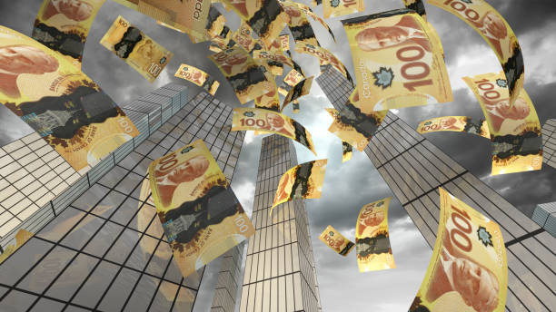 istock Canadian Dollars Flying in City 1345193557