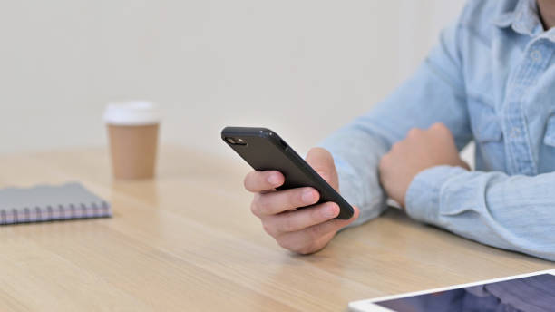 istock Hand of Man using Smartphone, Close up 1345194133
