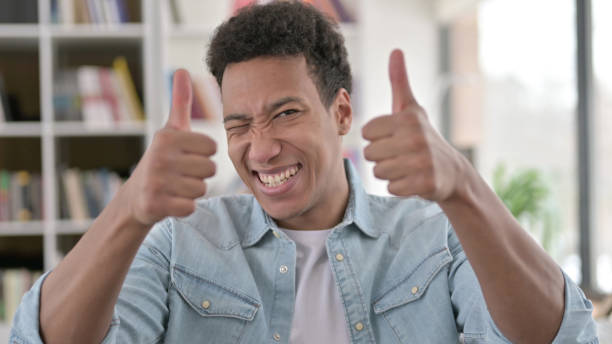 istock Thumbs up by Cheerful Young African American Man 1345194342