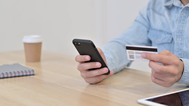 istock Credit Card Payment on Smartphone by Man, Close up 1345194354