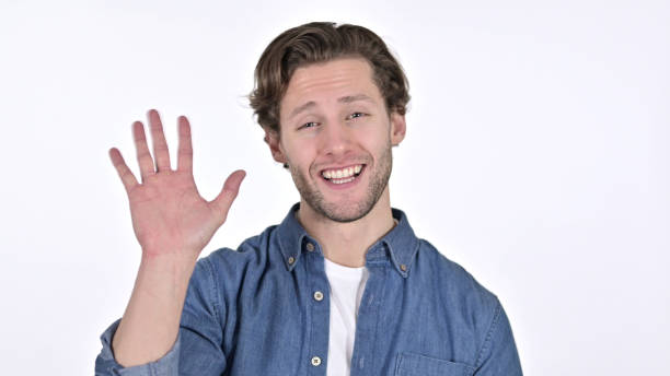 istock Attractive Young Man Waving and Welcoming on White Background 1345195266