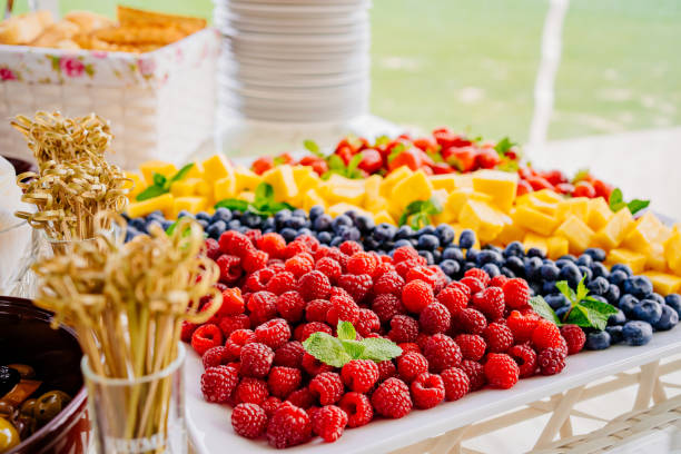 istock fruit assorted. raspberries, blueberries, pineapple and strawberries 1345195608
