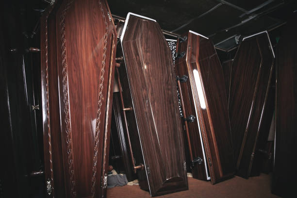 Wooden coffins in the dark room.