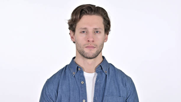 istock Young Man Looking at the Camera on White Background 1345197024