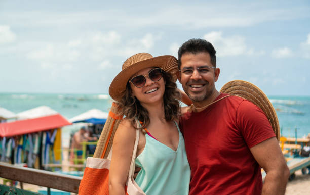 istock Smiling couple on the beach 1345198664