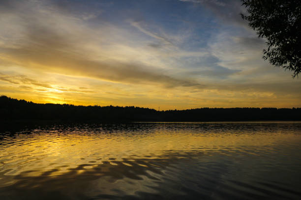 istock Sunset river water reflection landscape. River sunset reflection. Sunset river landscape. Sunset orange river view. 1345201345