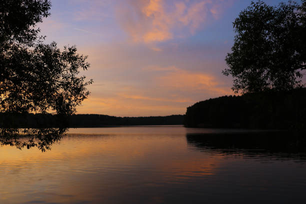 istock Sunset river sky clouds landscape. River sunset horizon view. Sunset river landscape. River sunset view. 1345201349