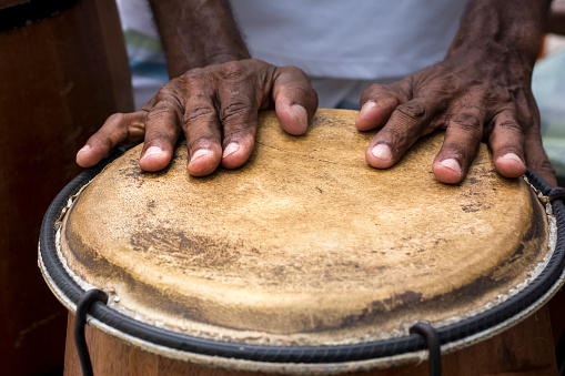 Hands of a musician playing percussion in presentation. Salvador, Bahia, Brazil.