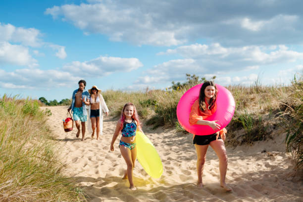 istock Family arriving at the beach 1345201917