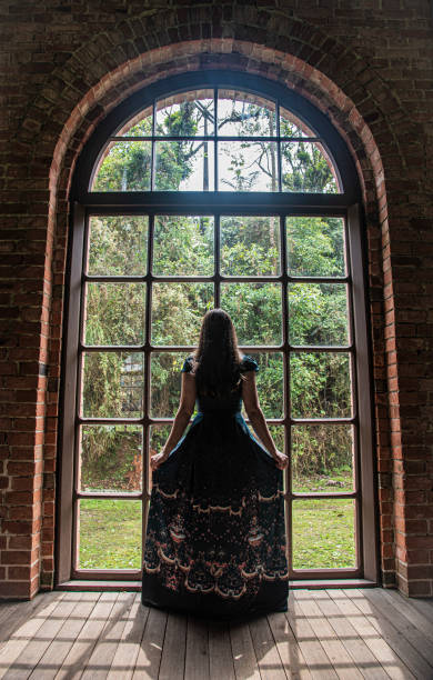 istock A woman looking at the window 1345202767