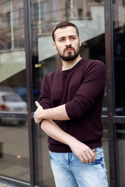istock Fashionable man posing in old city 1345203046