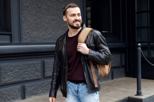 istock Fashionable man posing in old city 1345203057