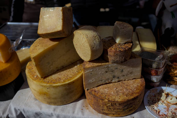 istock Presentation of various types of round cheeses. 1345203998
