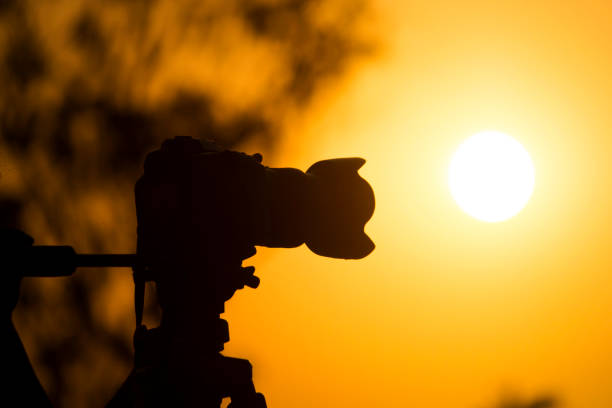 istock DSLR Camera Stand on a Tripod at a Beautiful Sunset 1345204008