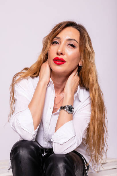 istock Smiling confident middle aged business woman standing isolated 1345204154
