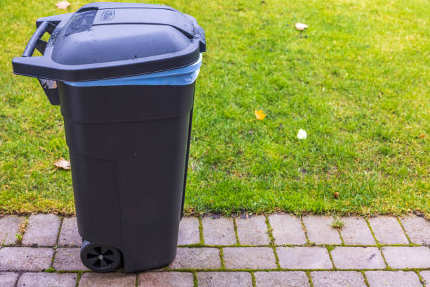 istock Close up view of garbage container on backyard on green field background. Sweden. 1345204704