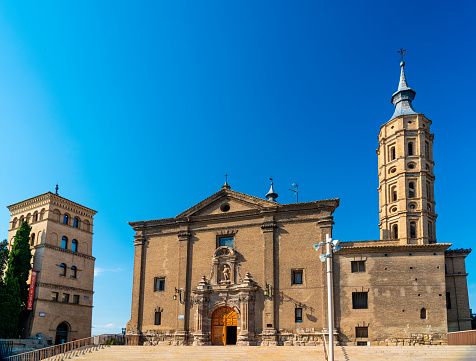 The Church of San Juan de los Panetes was built in 1725 in Zaragoza, Spain. The Torreon de la Zuda (Tower of the Zuda) is to the left of the church.