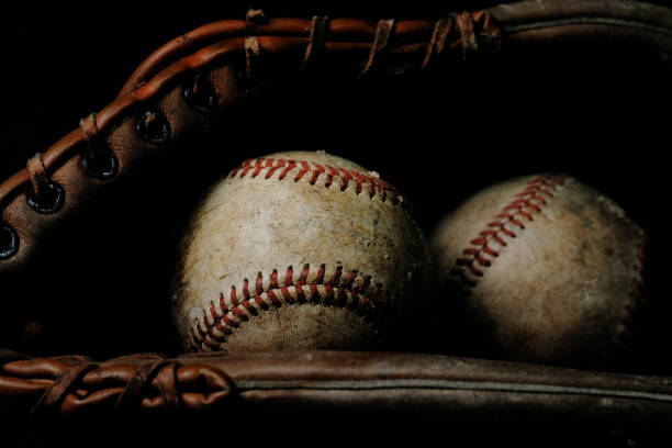 Dark baseball equipment still life