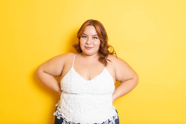 istock Plus size redhead young woman modeling with smile. overweight model 1345213041