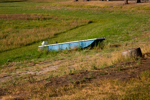 Boat abandon on a dry lake during drought