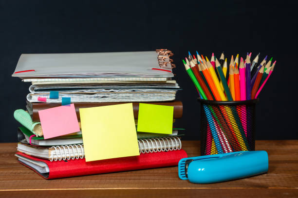istock Sticker with space for text on the background of the educational installation. Textbooks, pencils. Learning concept 1345215926