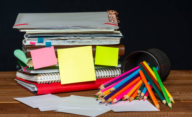 istock Sticker with space for text on the background of the educational installation. Textbooks, pencils. Learning concept 1345215962