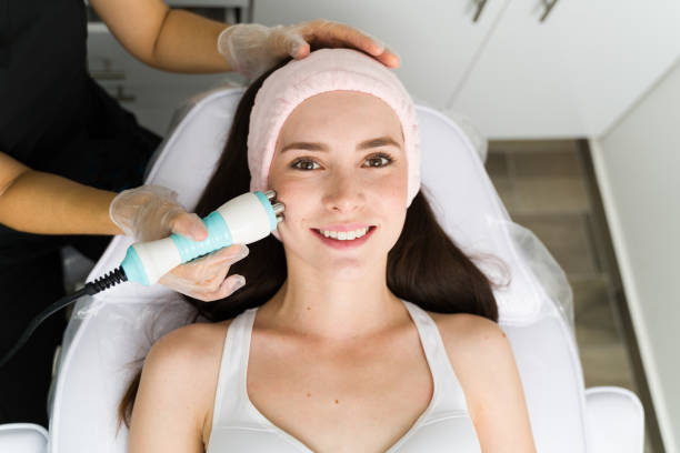 istock Happy woman doing a facial lifting 1345217083