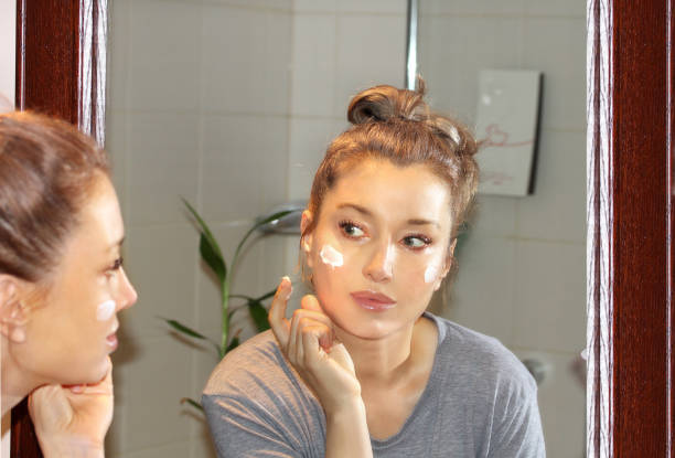 istock Applying the cream..Magic anti-aging cream. 1345217136