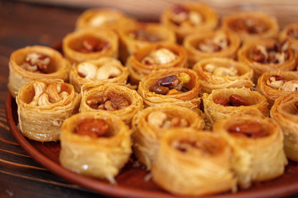 istock Turkish baklava dessert with honey, close up 1345220219