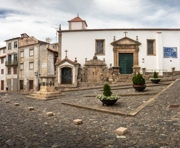 View of Largo do Principal with the church of São Vicente in the background, in Bragança, Portugal. stock photo