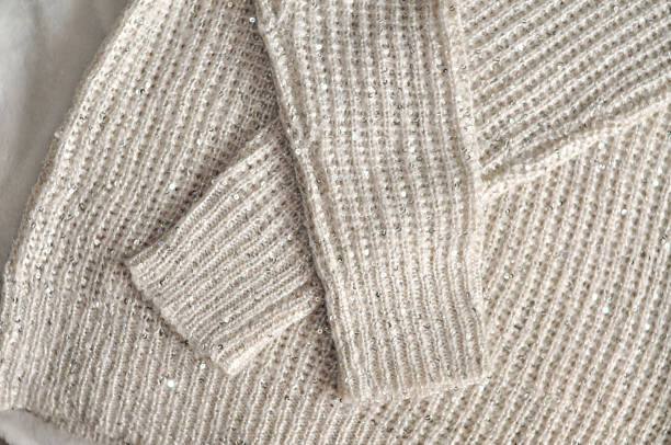 istock Close up of cozy warm sweaters copy space 1345224747