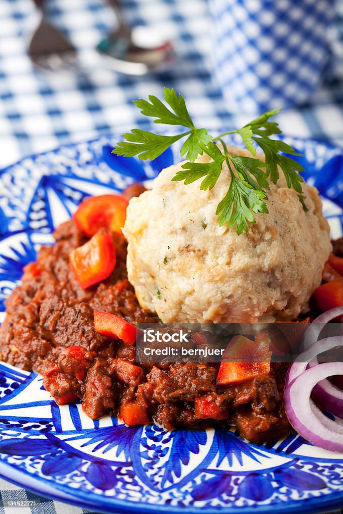 goulash goulash with dumpling on a blue plate Beef Stock Photo