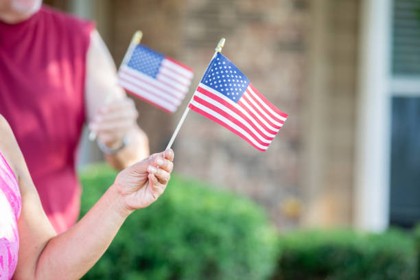 Adults Holding American Flags in hands