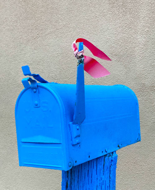 istock Santa Fe Style: Rural US Blue Mailbox With Red Flag Up 1345235771