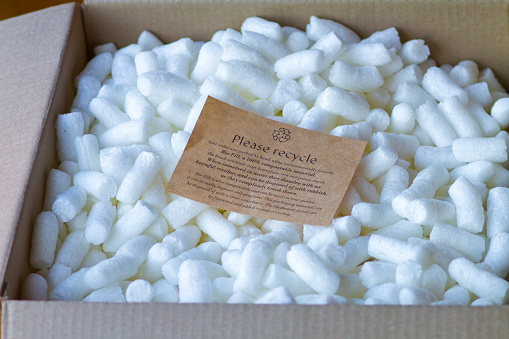 Recyclable packing peanuts with instructions. Please recycle.