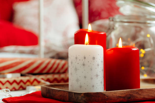 istock Red and white Christmas candles interior decoration 1345239415